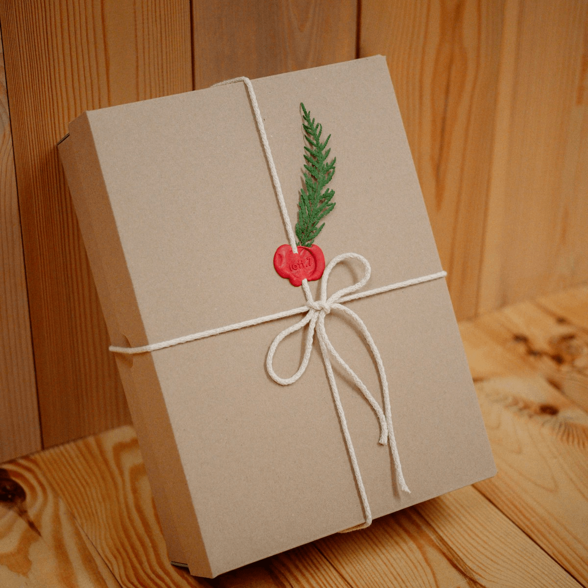 A signature ribbon-tied Elevenkin gift box, styled with roses and a keepsake journal